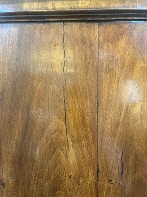 Lot 25 - A George II figured walnut secretaire chest on chest