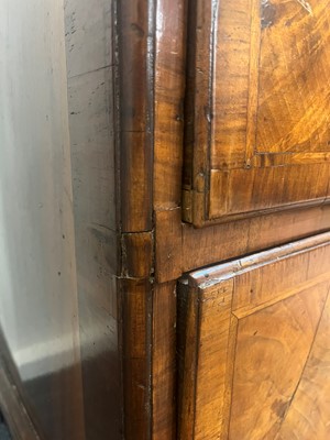 Lot 25 - A George II figured walnut secretaire chest on chest
