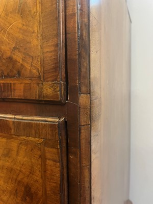Lot 25 - A George II figured walnut secretaire chest on chest