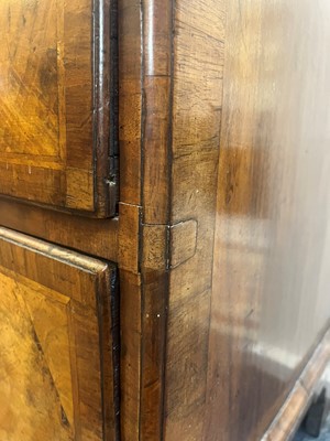 Lot 25 - A George II figured walnut secretaire chest on chest