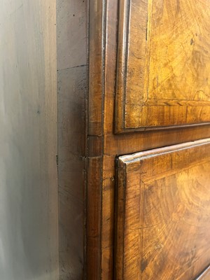 Lot 25 - A George II figured walnut secretaire chest on chest