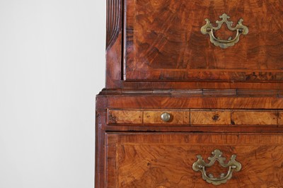 Lot 25 - A George II figured walnut secretaire chest on chest