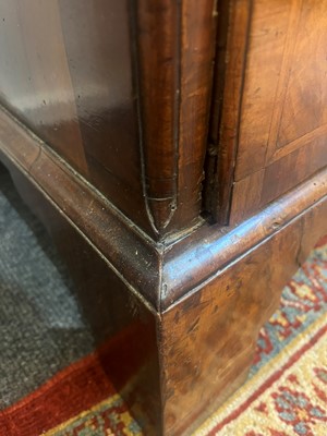 Lot 25 - A George II figured walnut secretaire chest on chest