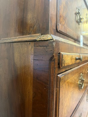 Lot 25 - A George II figured walnut secretaire chest on chest
