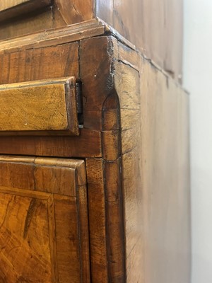 Lot 25 - A George II figured walnut secretaire chest on chest