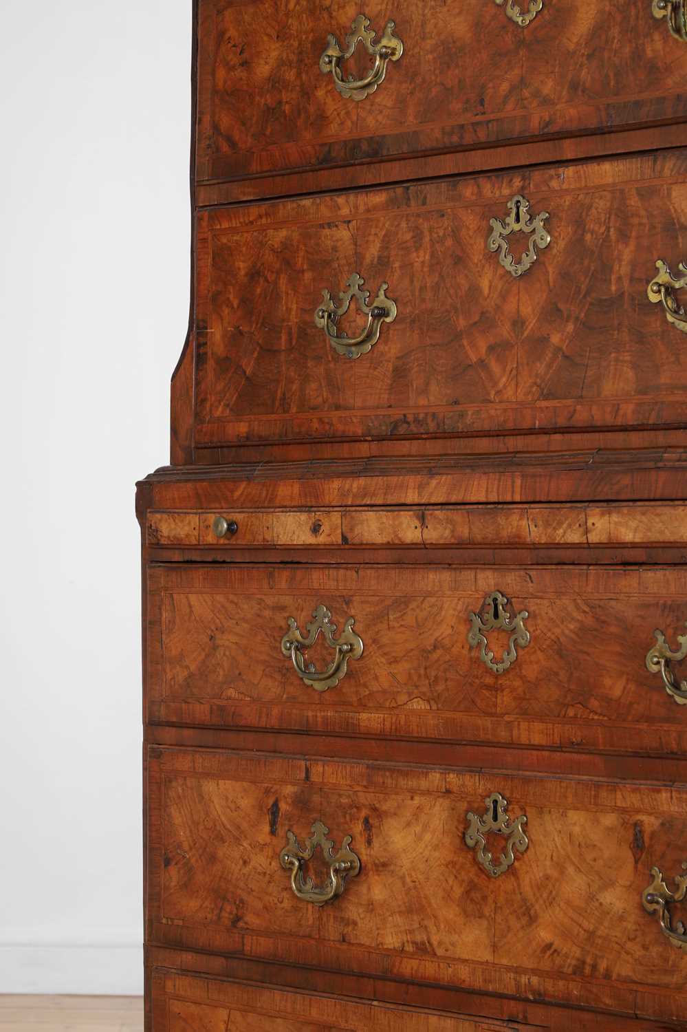 Lot A George II figured walnut secretaire chest on chest