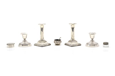 Lot 37 - A pair of silver dwarf candlesticks