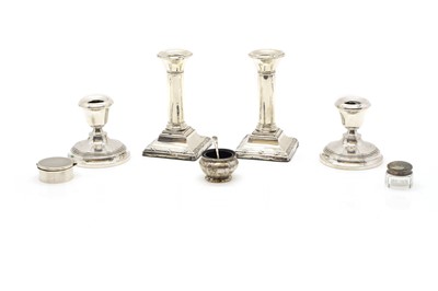 Lot 37 - A pair of silver dwarf candlesticks