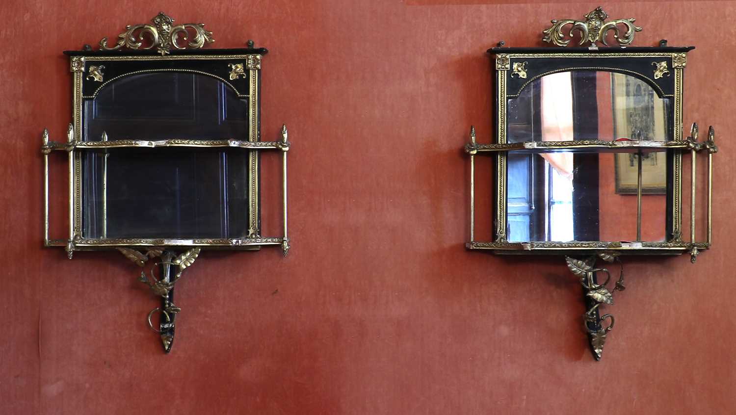 Lot 49 - A pair of parcel gilt wall shelves