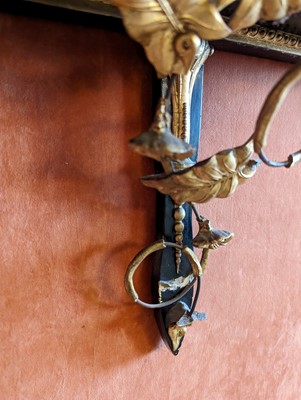 Lot 49 - A pair of parcel gilt wall shelves