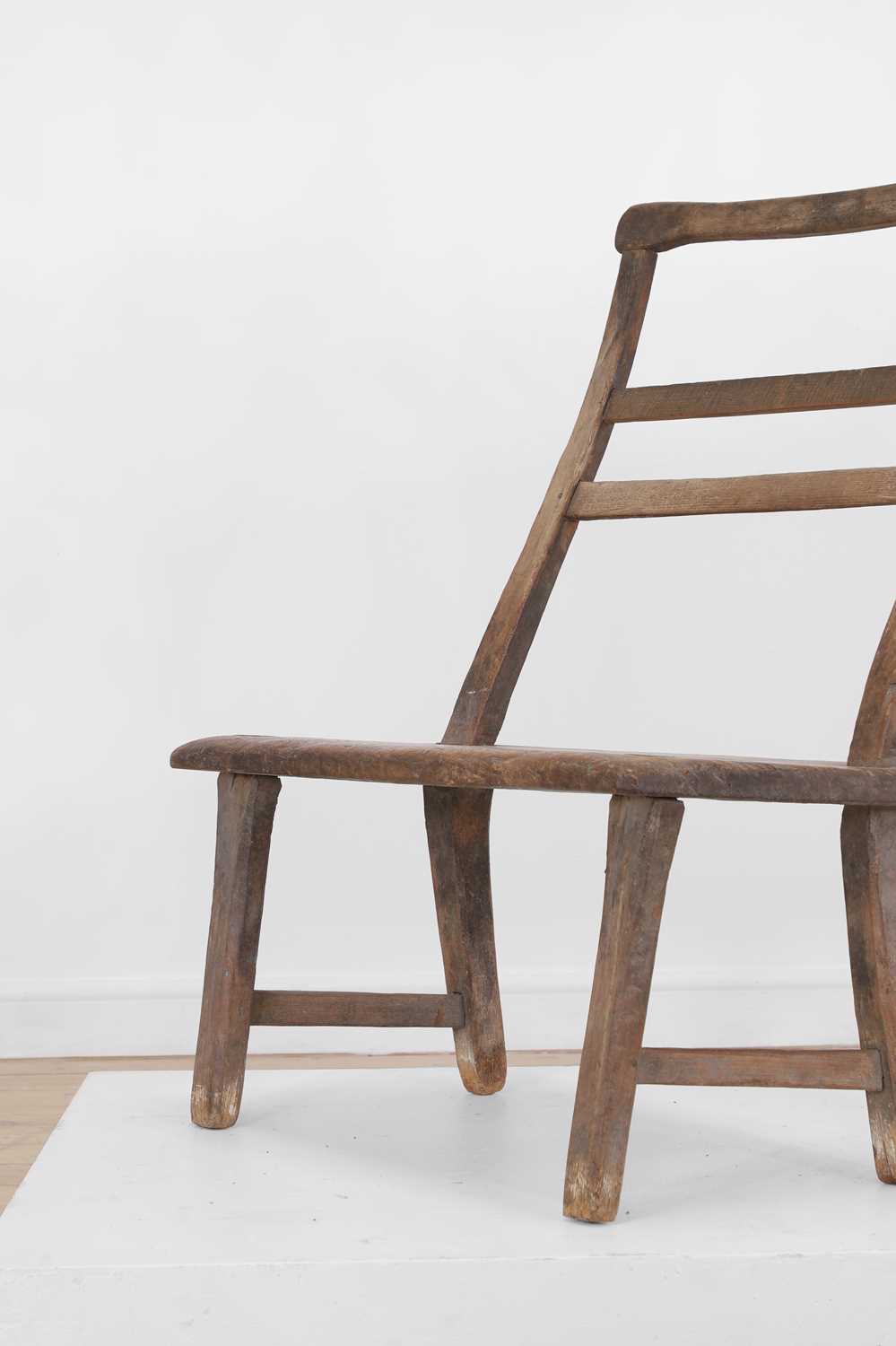 Lot 28 - A primitive elm joined bench