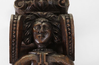 Lot 73 - A carved oak corbel