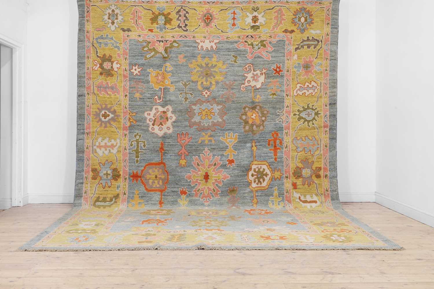 Lot 5 - An Oushak wool carpet