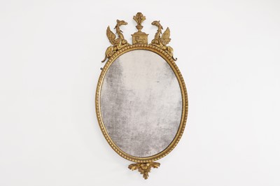 Lot 359 - A George III giltwood oval mirror