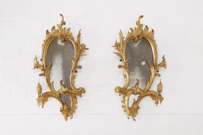 Lot 429 - A pair of George III carved giltwood girandoles, after a design by Thomas Chippendale