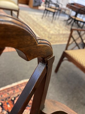 Lot 66 - A set of four George III-style mahogany 'cockpen' elbow chairs