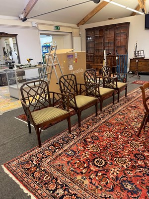 Lot 66 - A set of four George III-style mahogany 'cockpen' elbow chairs
