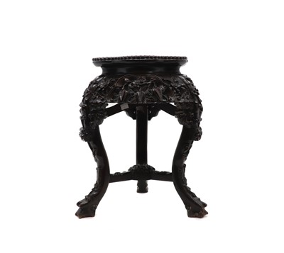 Lot 51 - A carved hardwood jardiniere stand