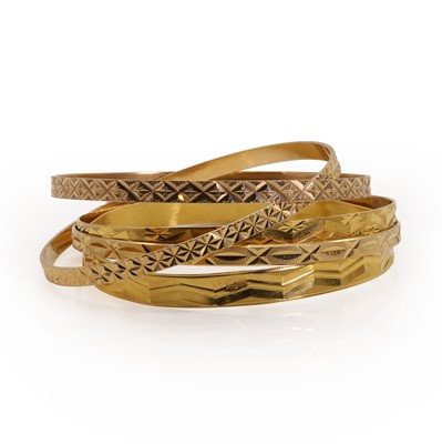 Lot 267 - Five gold bangles