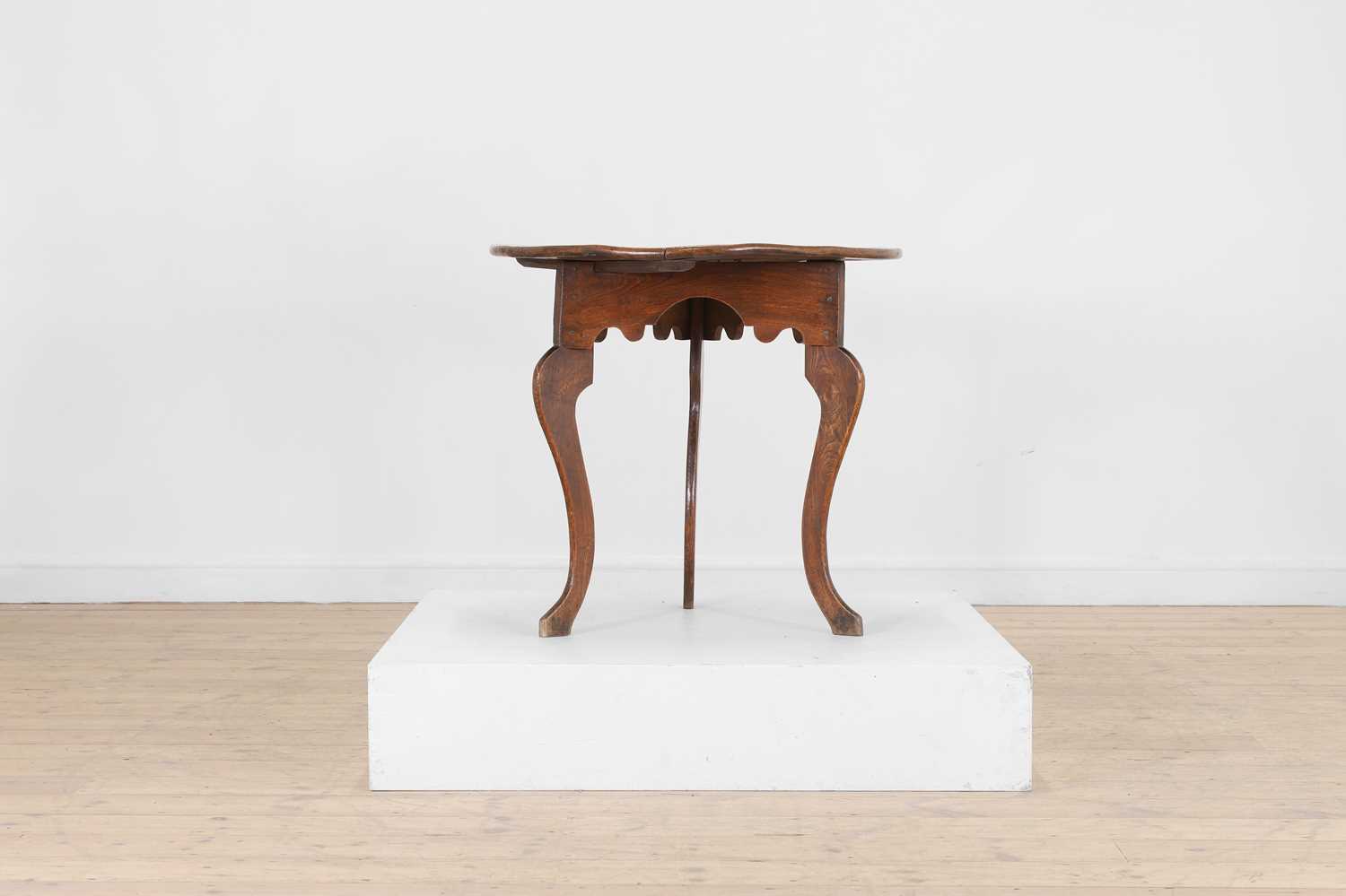 Lot 56 - A George III elm cricket table