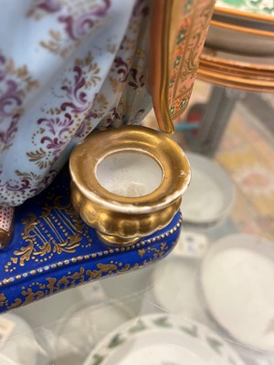 Lot 54 - A pair of porcelain figural scent holders