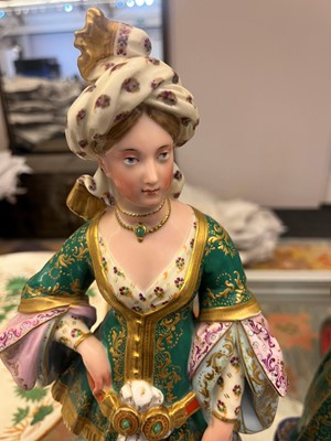 Lot 54 - A pair of porcelain figural scent holders