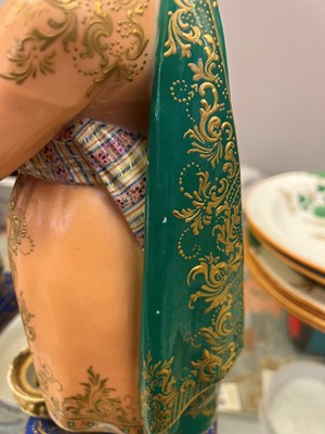 Lot 54 - A pair of porcelain figural scent holders