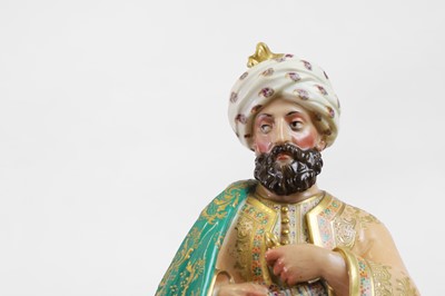 Lot 54 - A pair of porcelain figural scent holders