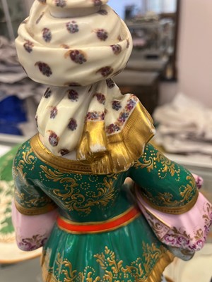 Lot 54 - A pair of porcelain figural scent holders