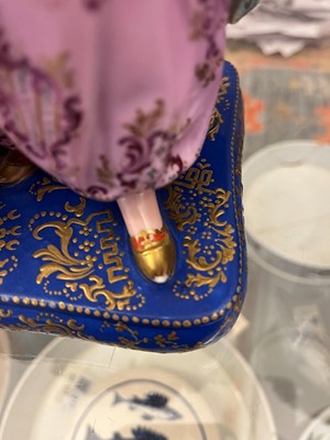 Lot 54 - A pair of porcelain figural scent holders