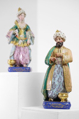 Lot 54 - A pair of porcelain figural scent holders