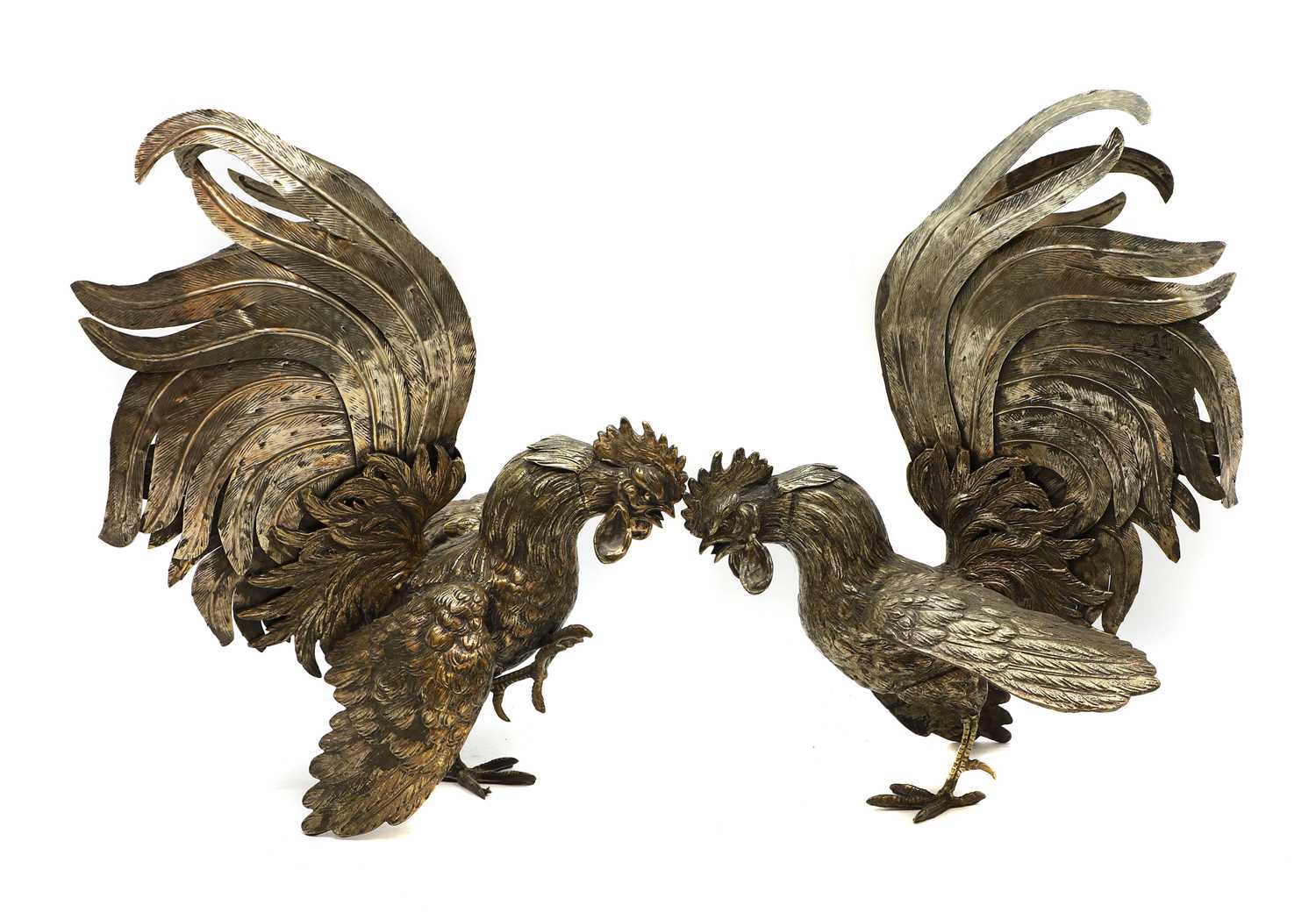 Lot 39 - A pair of silvered fighting cockerels