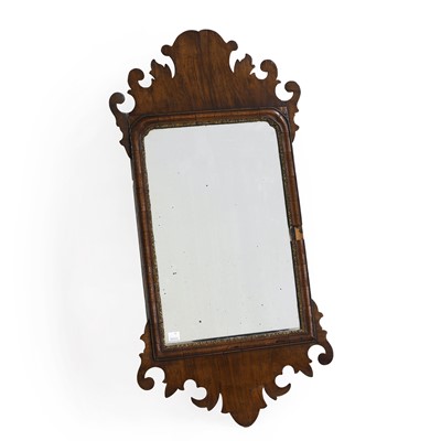 Lot 393 - A George II walnut fret carved wall mirror