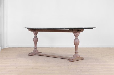 Lot 443 - A limed oak dining table
