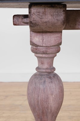 Lot 443 - A limed oak dining table