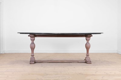 Lot 443 - A limed oak dining table