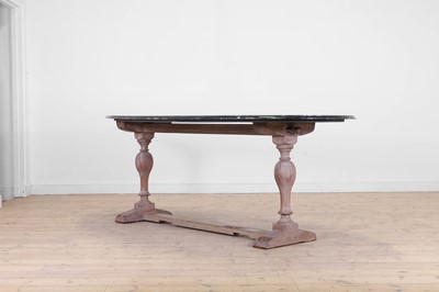 Lot 443 - A limed oak dining table