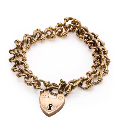 Lot 31 - An Edwardian gold bracelet with a heart shaped padlock