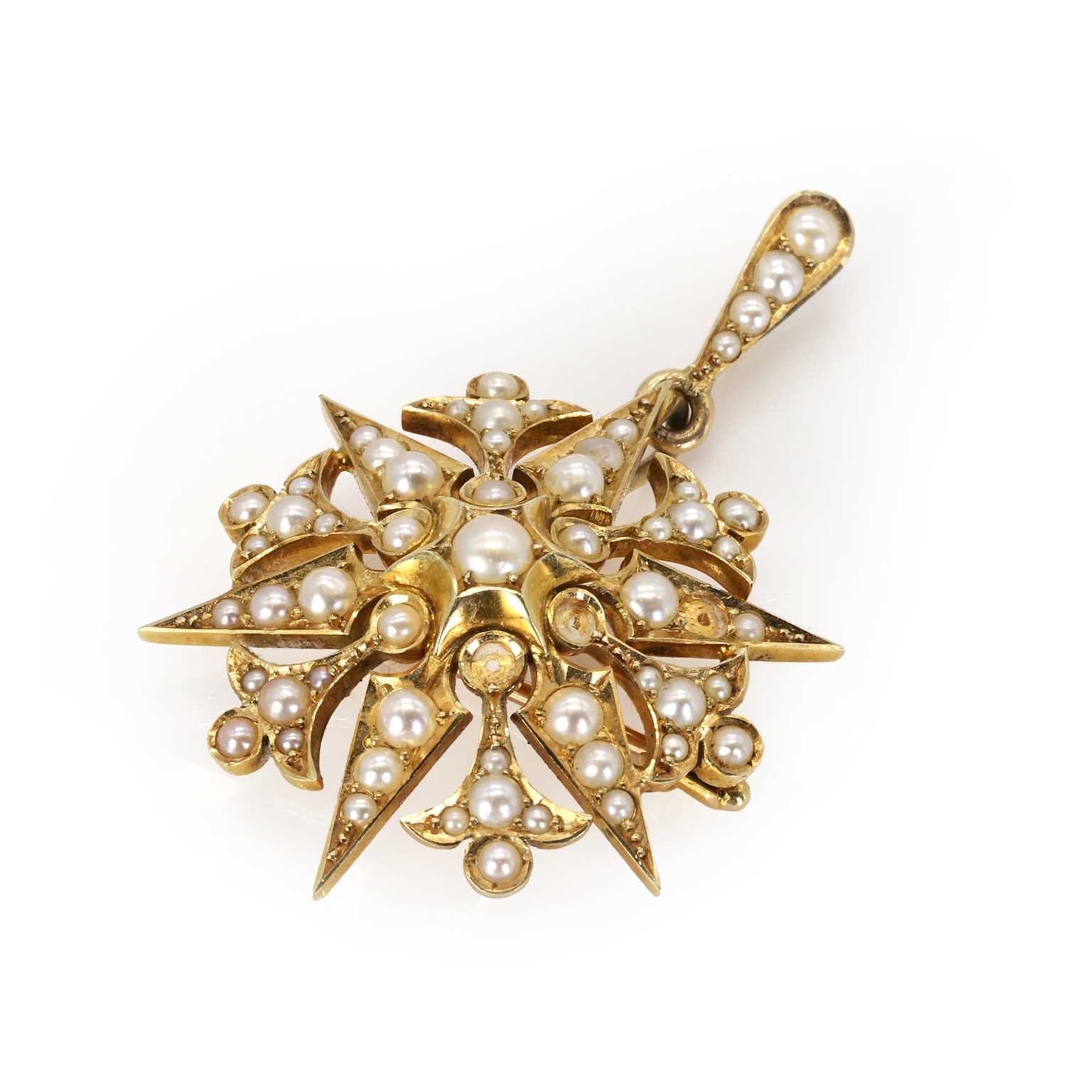 Lot 22 - An Edwardian gold split pearl starburst brooch