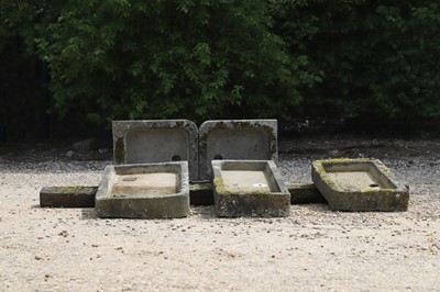 Lot 675 - A series of five weathered stone sinks