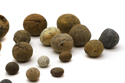 Lot 154 - A collection of stone cannon balls