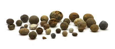 Lot 154 - A collection of stone cannon balls