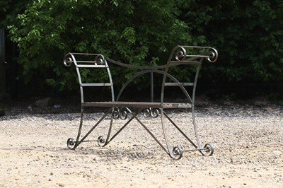 Lot 676 - A wrought-iron garden seat