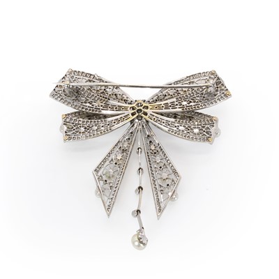 Lot 54 - A diamond and pearl ribbon bow brooch, c.1915