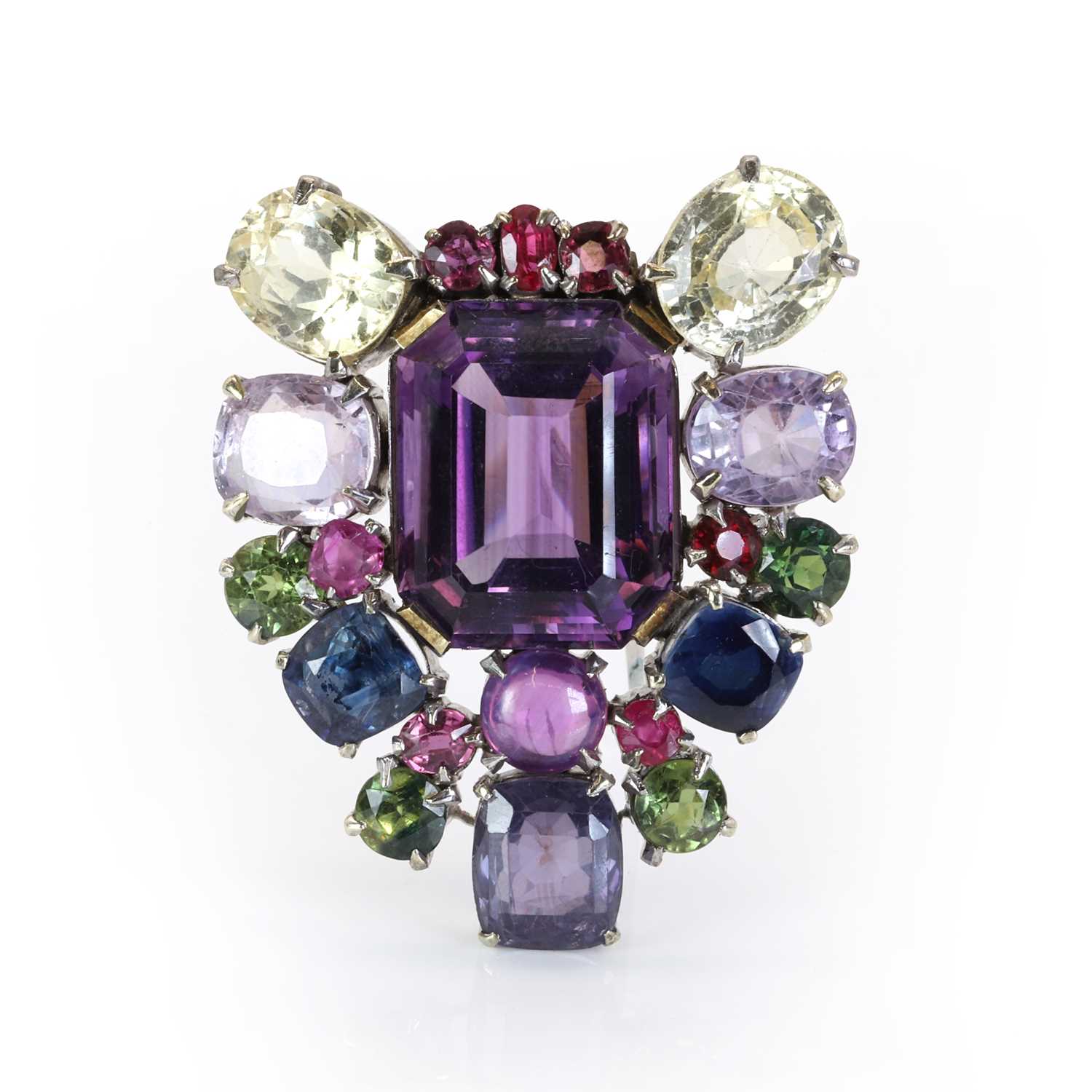 Lot 87 - A varicoloured sapphire and amethyst clip brooch, c.1940-1950