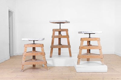 Lot 80 - A set of three pine and metal pottery stands