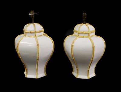 Lot 333 - A pair of white-glazed pottery lamps