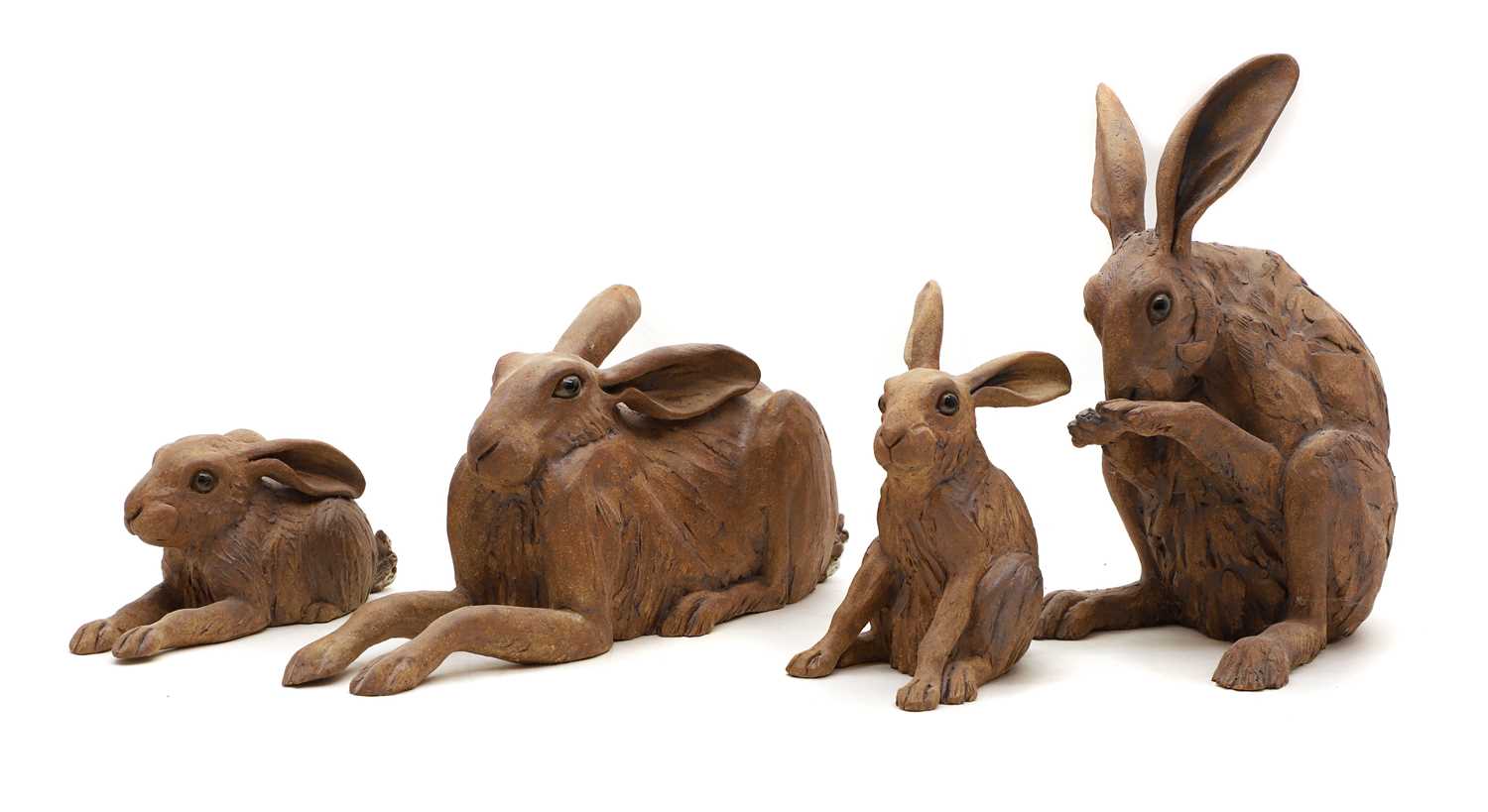 Lot 97 - A group of four pottery hares