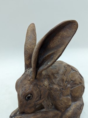Lot 97 - A group of four pottery hares