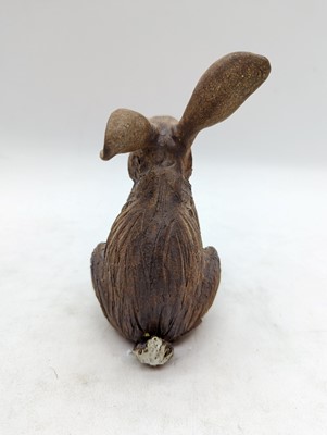 Lot 97 - A group of four pottery hares